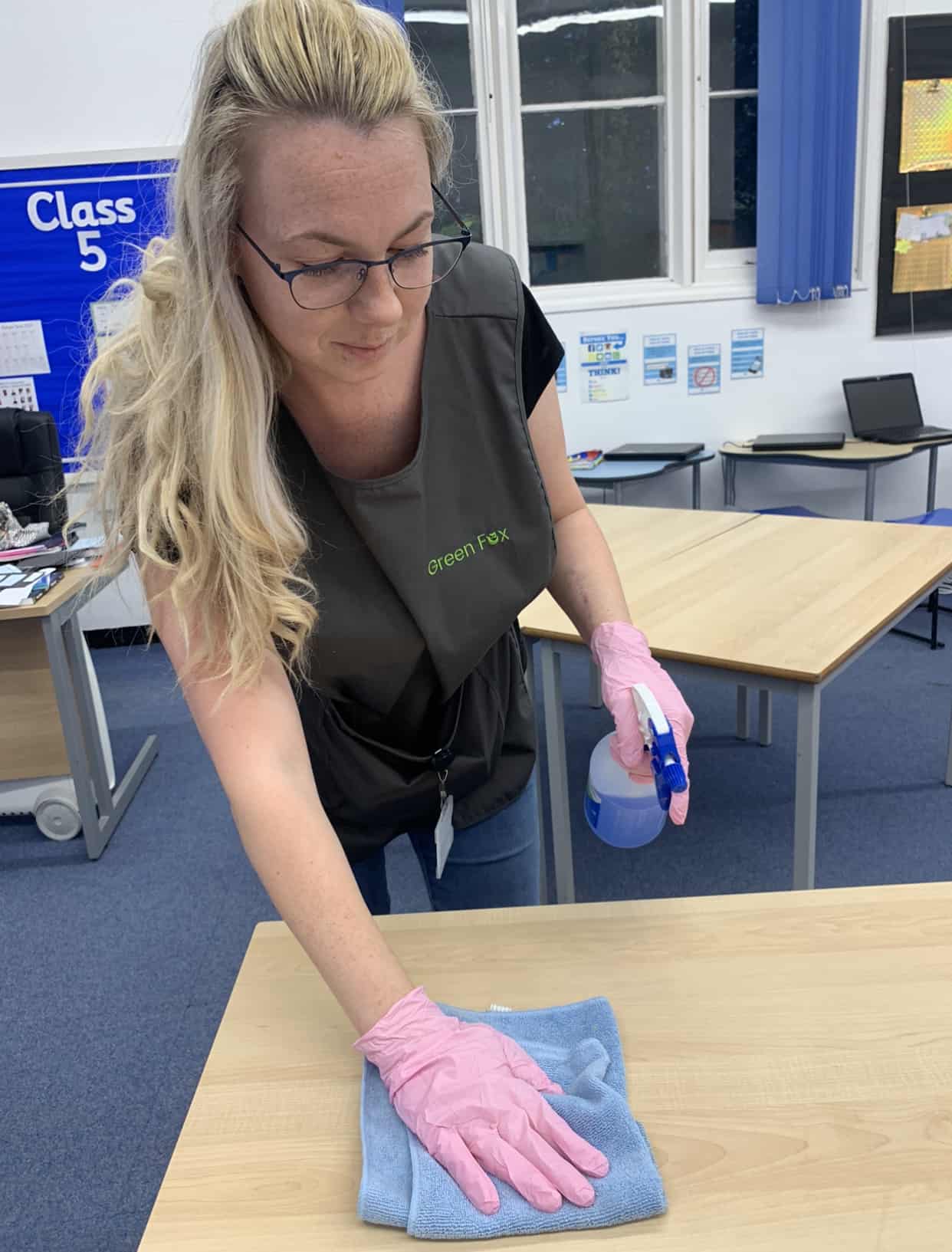 Green Fox employee completing school cleaning services